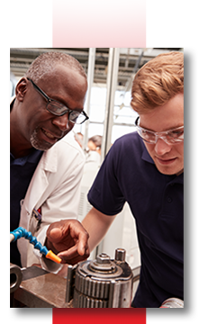 Businesses Page Individual Image Mentor and student working on a piece of machinery.